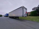 a semi truck that is parked on the side of the road