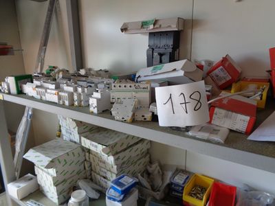 a shelf with many boxes and boxes on top of it