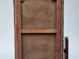 an old wooden easel with a piece of wood on top of it