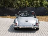 a silver car that is parked on the side of the road