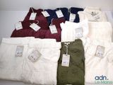 five pairs of men ' s clothing on display on a table