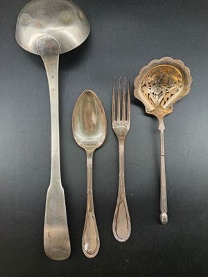 four spoons, a spoon, and a spoon on a table