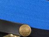 a close up of a blue belt with a gold buckle