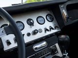 a steering wheel and dashboard of a car with various gauges