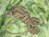 a close up of a rope on a camouflage cloth