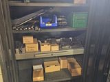 a metal shelving with lots of tools in it