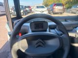 a steering wheel and dashboard of a small car
