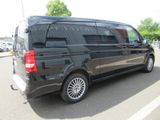 a black van that is parked in a parking lot