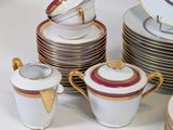 a lot of plates and cups on the table