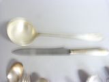 a spoon, fork, and knife on a table