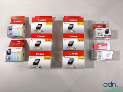 several canon ink cartridges are stacked on top of each other on a white surface