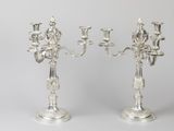 pair of silver plated candelabs with flowers and leaves