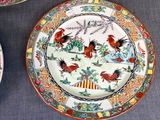 three plates with designs on them are sitting on a table