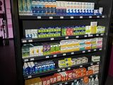 a display of milk, juice, and other drinks in a store