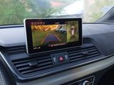 the dashboard of a car with a tablet on the dashboard