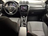 the interior of a car with a steering wheel, dashboard, and dashboard controls