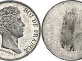 a close up of a coin on a white background
