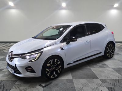 a white car is parked in a room with a checkered floor