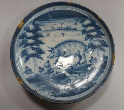 a blue and white plate with a bull on it