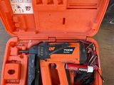 an orange tool case with a stapler, stapler and stapler in it
