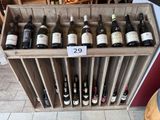 many bottles of wine in a wooden wine rack
