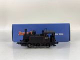 a toy train on a white surface with a blue box in the background