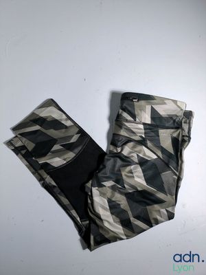 the leggings of a pair of black and white camouflage pants