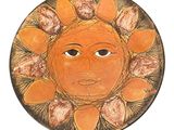 une assiette sur laquelle est représenté un visage de soleil sur fond blanc
