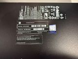 the back side of a laptop with a sticker on it