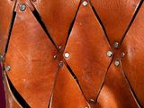 an old leather purse with rivets and rivets on it