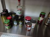 many different types of spices on the counter top