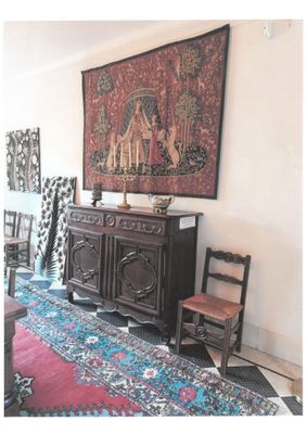 an image of a living room with a rug and a table
