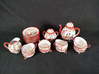 a group of cups and saucers sitting on a table