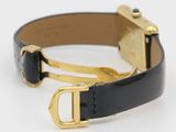 black leather bracelet with gold buckle on white background