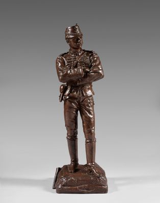 a bronze statue of a soldier with a helmet and a sword