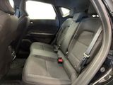 the back seats of a car with a remote control in it