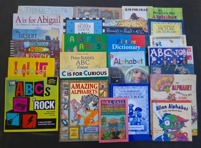 many children ' s books that are on the table