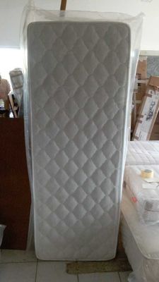 a mattress that is sitting in the middle of a room