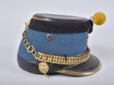 a blue hat with a gold chain around it