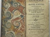 un livre ouvert sur lequel est dessiné un motif de volutes