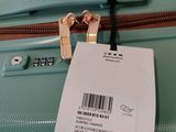 a tag on a piece of luggage that has a price tag attached to it