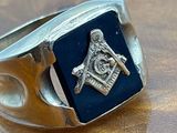 an image of a ring with a masonic symbol on it