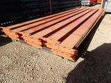 a large pile of lumber sitting on the ground