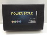 a black power style battery charger sitting on top of a white table