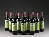 six bottles of red wine are lined up in a row