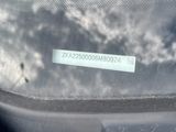 a reflection of a man in the windshield of a car