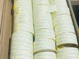 many rolls of tape in a box on a table