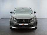 the front view of a grey car in a white room