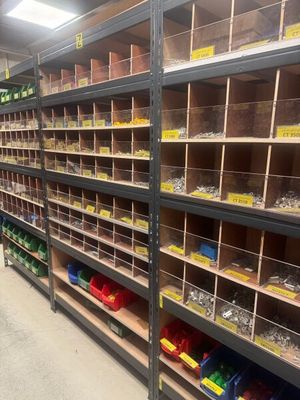 a lot of shelves that have many different types of tools on them
