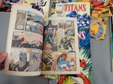 a person holding a comic book open on a table